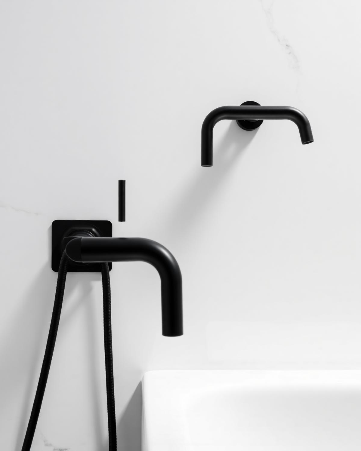Matte black wall-mounted mixer